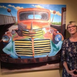 Ingrid McGarry with one of her paintings